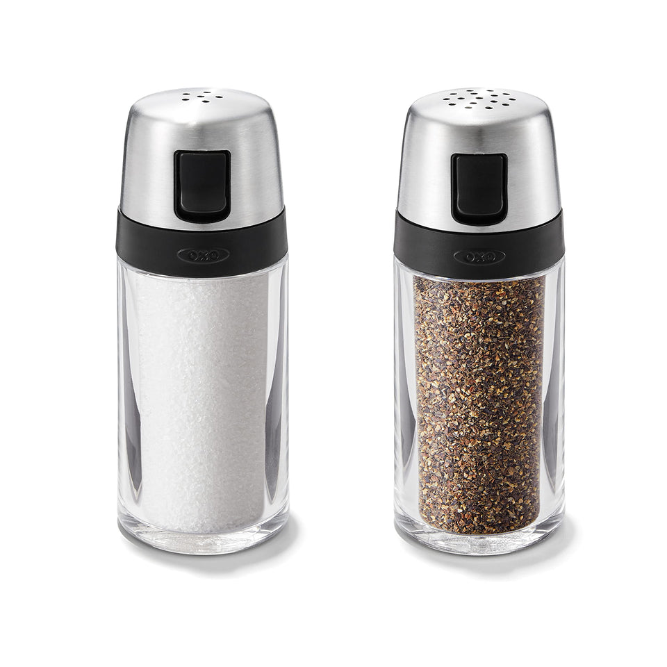 OXO salt and pepper shaker set with clear body and stainless steel accents for easy fill level visibility.