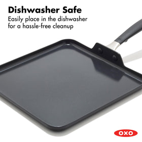 OXO silicone-handle close-up showing ergonomic grip for comfortable cooking.