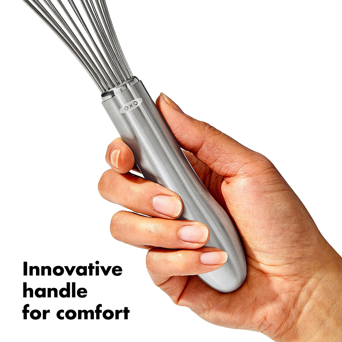 OXO Steel 11-In Whisk in action whisking eggs smoothly.