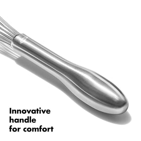 OXO SteeL whisk in action emulsifying batter with steady motion.