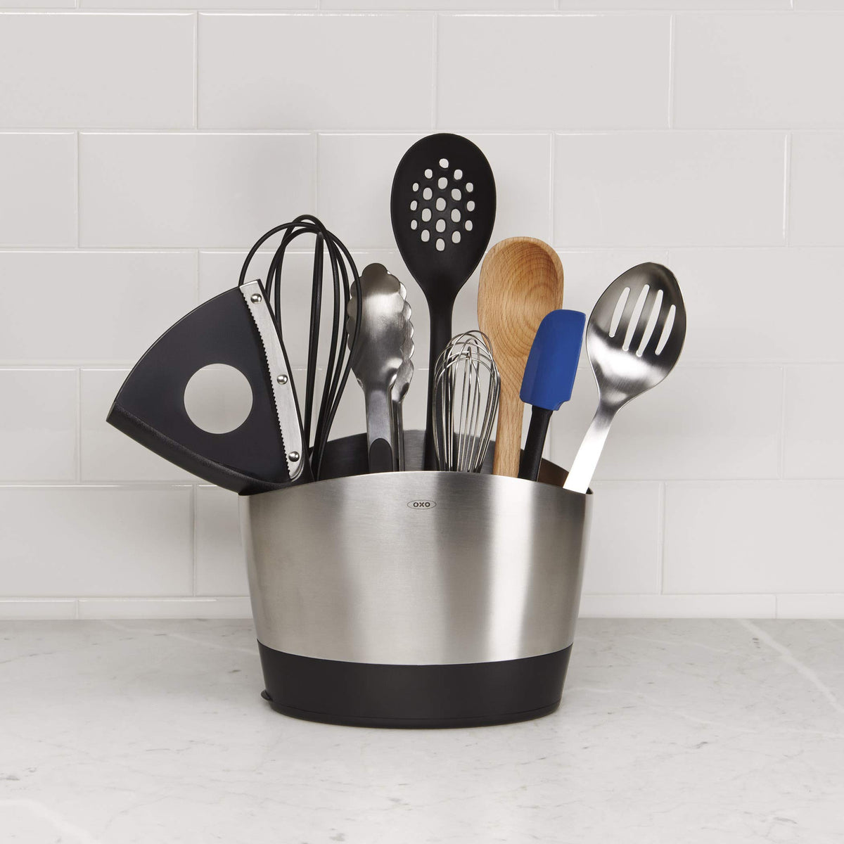 OXO SteeL 9-Inch Whisk kitchen scene with eggs and batter.
