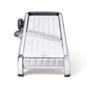 OXO SteeL Mandoline 2.0 blades stored on the board for quick access