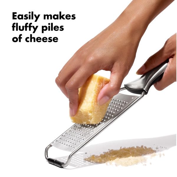 OXO Steel Grater zesting lemon over a bowl for bright flavors