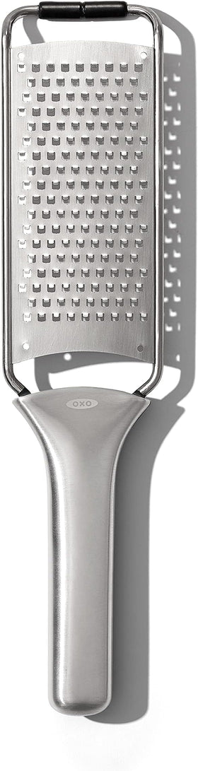 OXO Steel Grater shredding parmesan cheese for topping pasta
