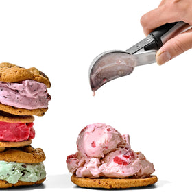 OXO Steel Lever Ice Cream Scoop with brushed stainless steel handle and soft non-slip grip.