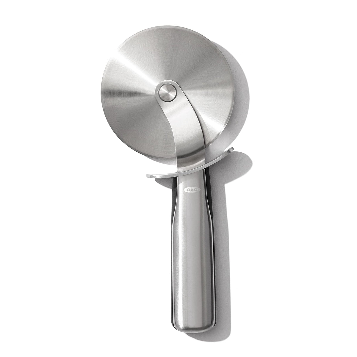 OXO Steel Pizza Wheel blade in action showing a sharp 4-inch cutting edge for clean slices