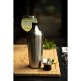 OXO Steel Shaker pouring action captured mid-pour.