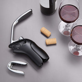 OXO Steel Vertical Lever Corkscrew with removable foil cutter beside it