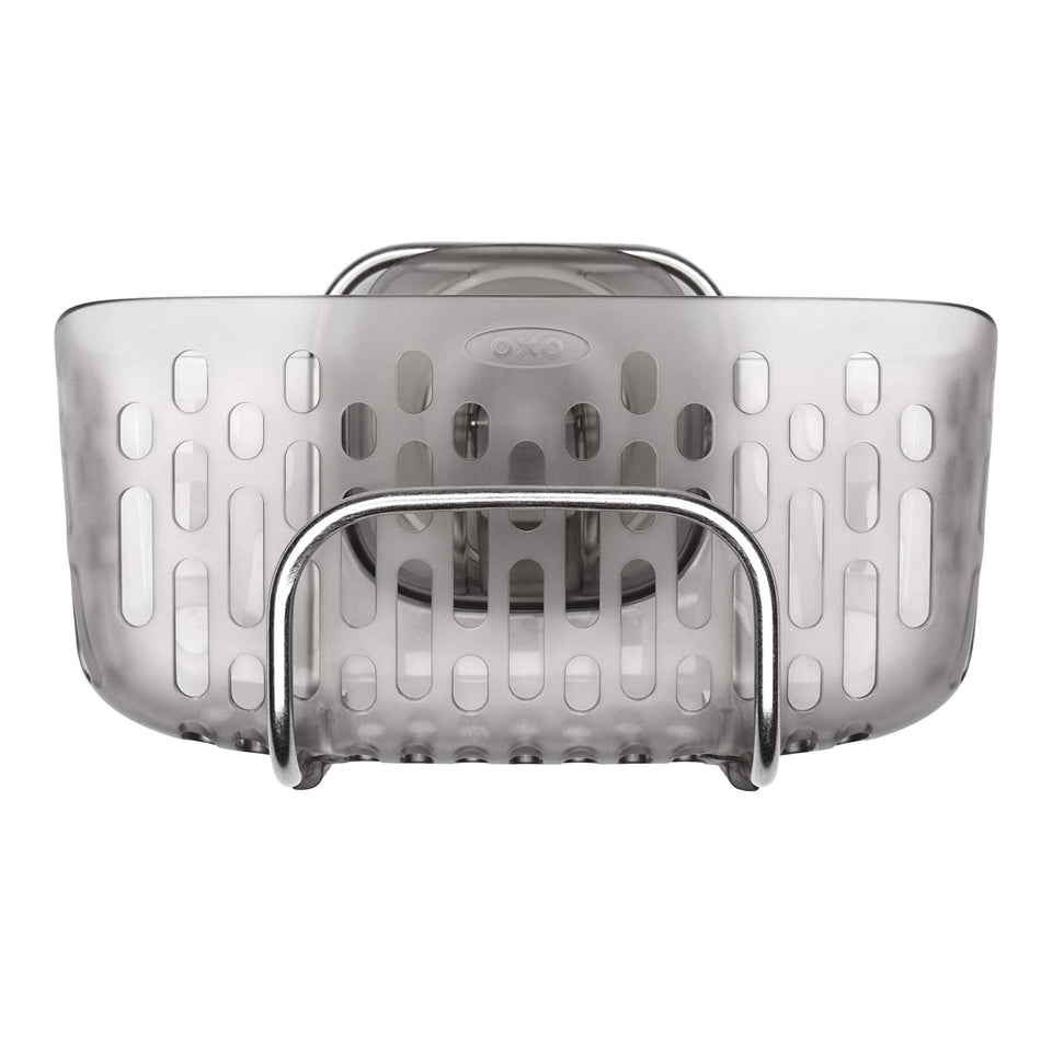 OXO Good Grips StrongHold suction sink caddy keeps sponges and brushes within reach.