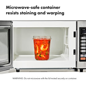 Universal lids on OXO containers showing one-size-fits-all compatibility