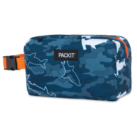 PackIt Box Snack Freezable Camo Sharks closed with buckle handle clipped to a backpack.
