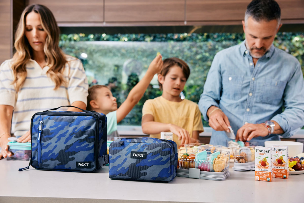 PackIt Classic Blue Camo buckle clip attaches to backpacks for easy transport.