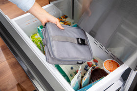PackIt Freezable Essential Cooler Gray Fog collapsed for compact storage.