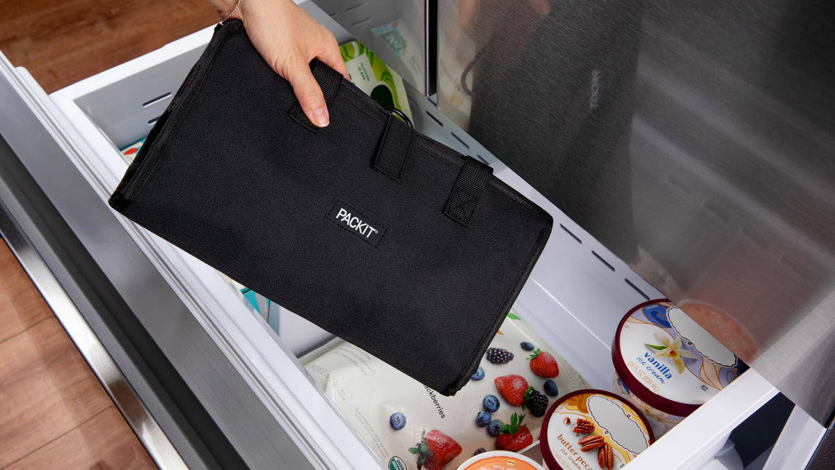 PackIt Freezable Grocery Tote in black, ready open for fresh shopping on the go.
