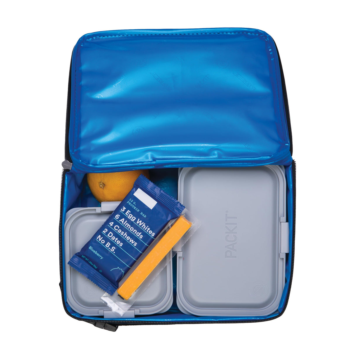 PackIt freezable lunch box in use keeps foods fresh during commute.