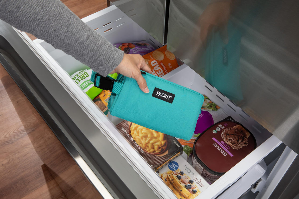 PackIt Freezable Snack Box teal interior liner shows non-toxic gel for safe cooling