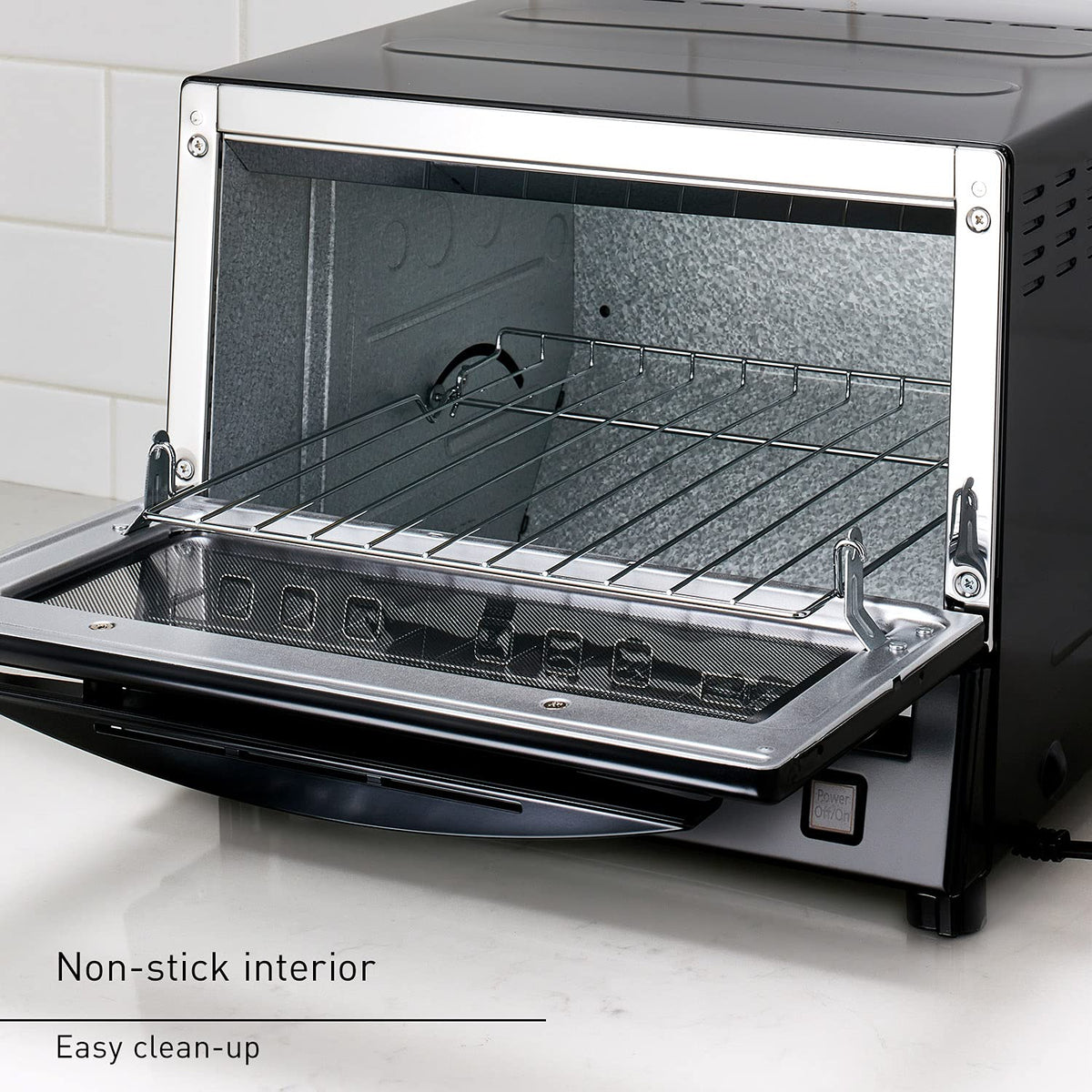 Panasonic FlashXpress removable crumb tray for easy cleaning after cooking.