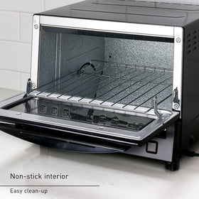 Panasonic FlashXpress removable crumb tray for easy cleaning after cooking.