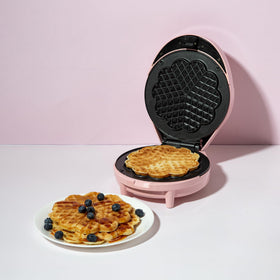 Chic pink Paris Hilton waffle maker enhances any kitchen counter.