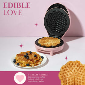 Pink Paris Hilton Heart Waffle Maker on a bright kitchen countertop.