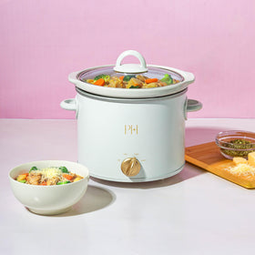 Paris Hilton slow cooker with lid off ready to prep ingredients for simmering.