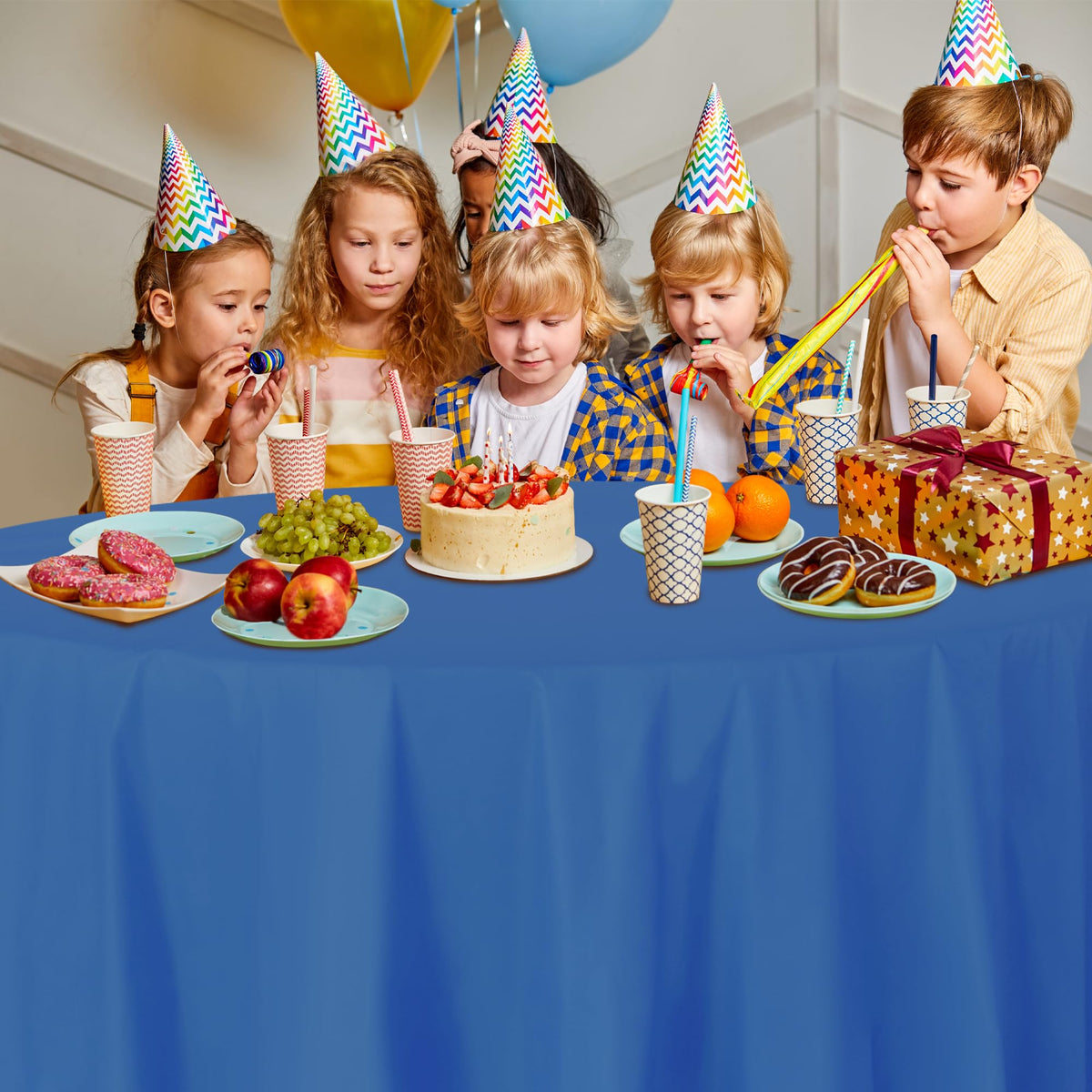 Blue disposable tablecloth at a wedding reception with versatile decor.