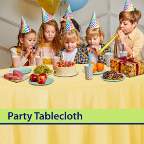 Party Dimensions yellow tablecloth provides protective surface for meals.