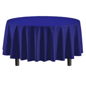 Party Solids 84-inch navy round tablecloth on the table creates a polished backdrop.