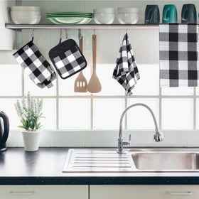 Patelai buffalo-check dish towels drying plates and utensils after meals
