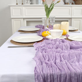 pepmily baby shower table decorated with lilac cheesecloth runner