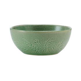 Pfaltzgraff Carrie green service-for-four set displayed on a modern table.