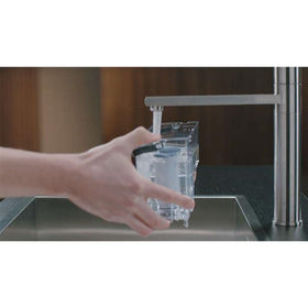 Graphic showing Philips AquaClean calcium blocking to reduce scale deposits.