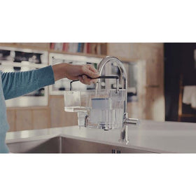 Philips AquaClean filter inserted to prevent scale buildup in espresso machines.