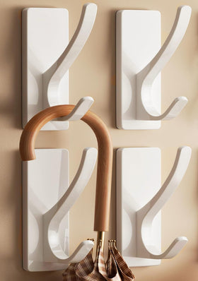 Pickpiff white coat hook with adhesive base blends into walls for clutter-free spaces