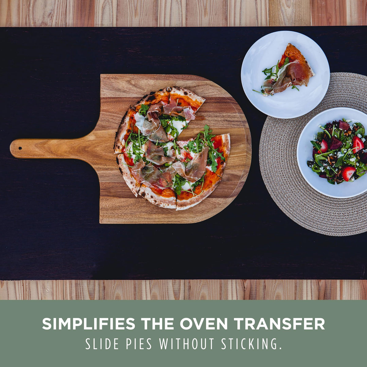 PICNIC TIME Acacia pizza peel used during oven transfer for safety.