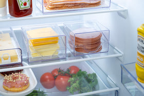 Pikanty cheese holder in action on fridge shelf for daily use.