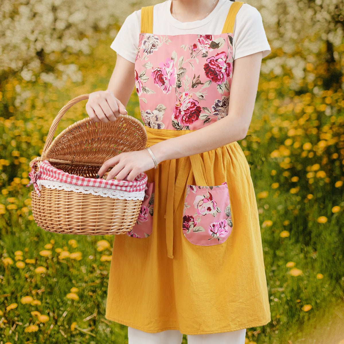 Pinknoke floral pattern apron with pockets keeps tools close while cooking.