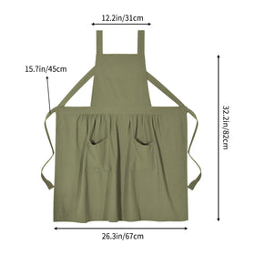 Pinknoke olive-green pinafore apron in kitchen setting