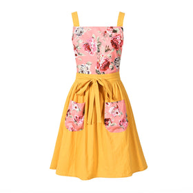 Pinknoke vintage pinafore apron in yellow with retro style for cooking.