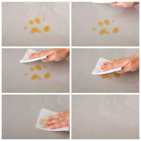 Pioggia clear tablecloth on a dining setup showcasing the table beneath