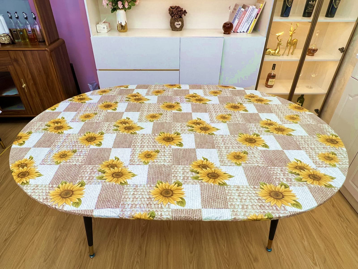 Pioggia tablecloth with elastic edges keeps the cover securely in place on oval tables