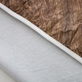 Pioggia outdoor tablecloth on a picnic table, weather-friendly and reusable.