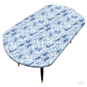 Pioggia oval tablecloth with flannel backing protects surfaces during meals