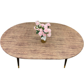 Pioggia oval vinyl fitted tablecloth with flannel backing protects surfaces in any room