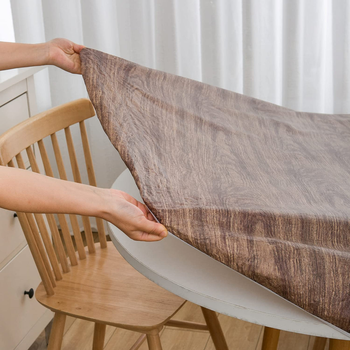 Pioggia waterproof table cover close-up shows a durable PVC surface ready for spills.