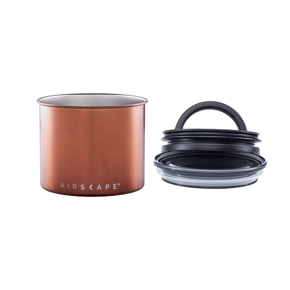 Planetary Design Airscape canister filled with coffee beans on a kitchen counter.