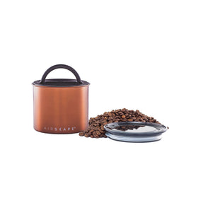 Planetary Design Airscape small brushed copper canister with airtight lid preserves coffee freshness.