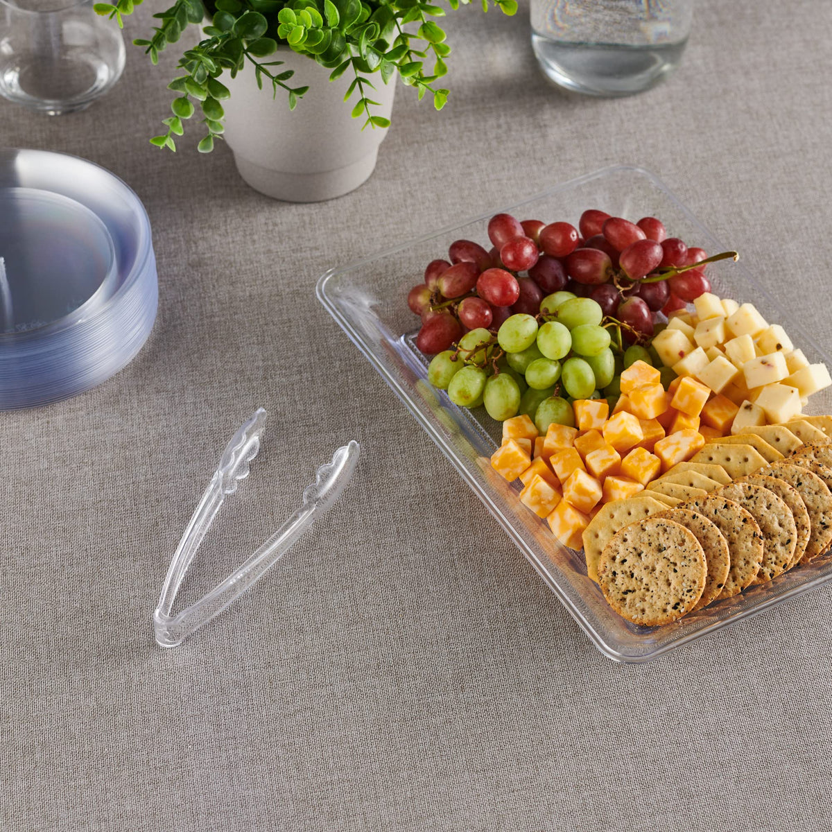 Plasticpro 12-pack clear serving tongs for events and catering.