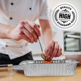 Plasticpro square pan with lasagna close-up, colorful layers ready to bake.