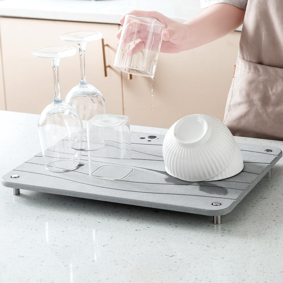 Plentio Stone Drying Mat on counter showing quick absorption for dishes.